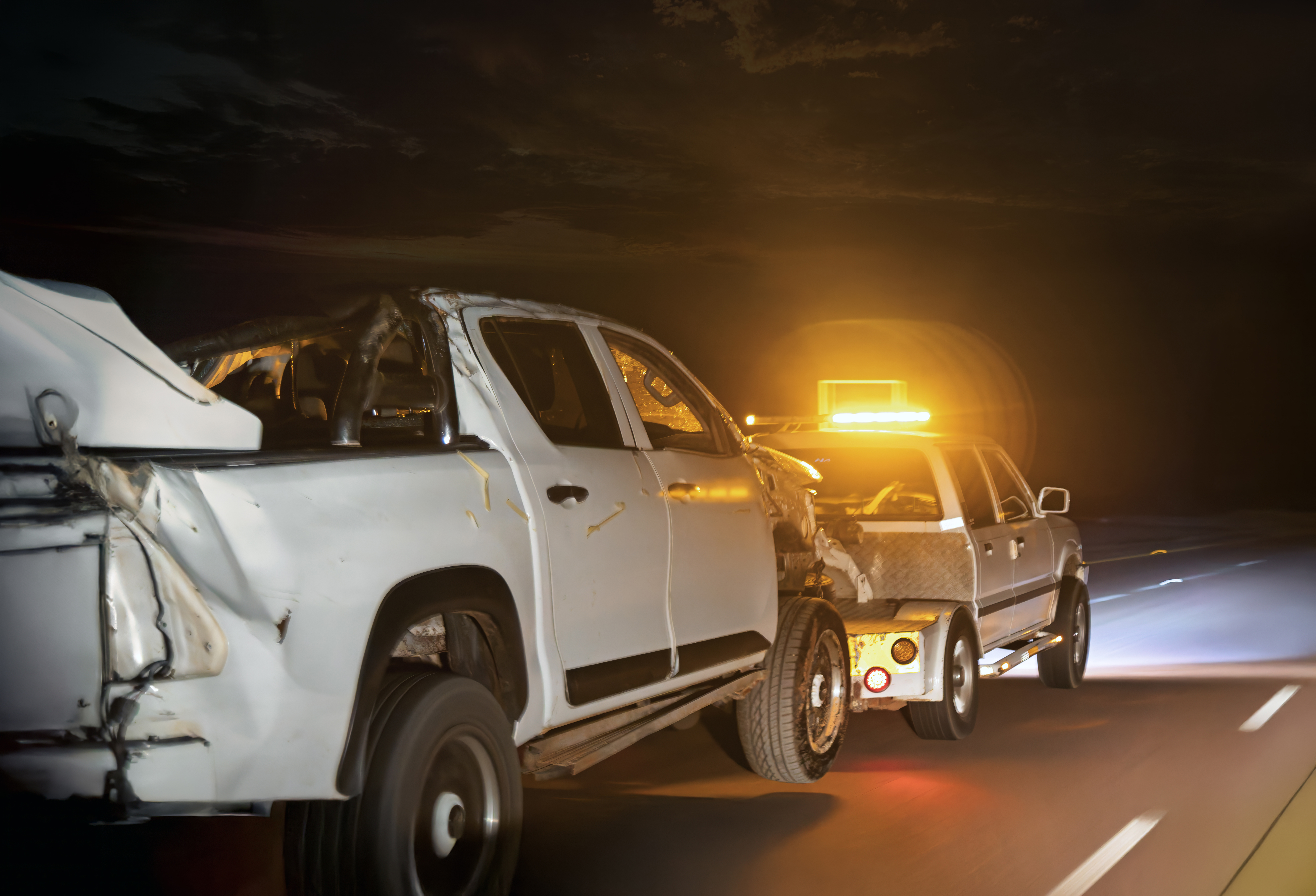 Car with low tow trailer in road, auto vehicles with carrier transporter hauler highway transport logistics haul with driver, Africa sunset